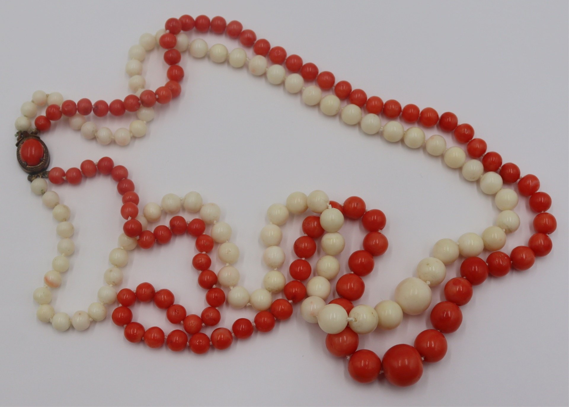 JEWELRY. DOUBLE STRAND CARVED CORAL