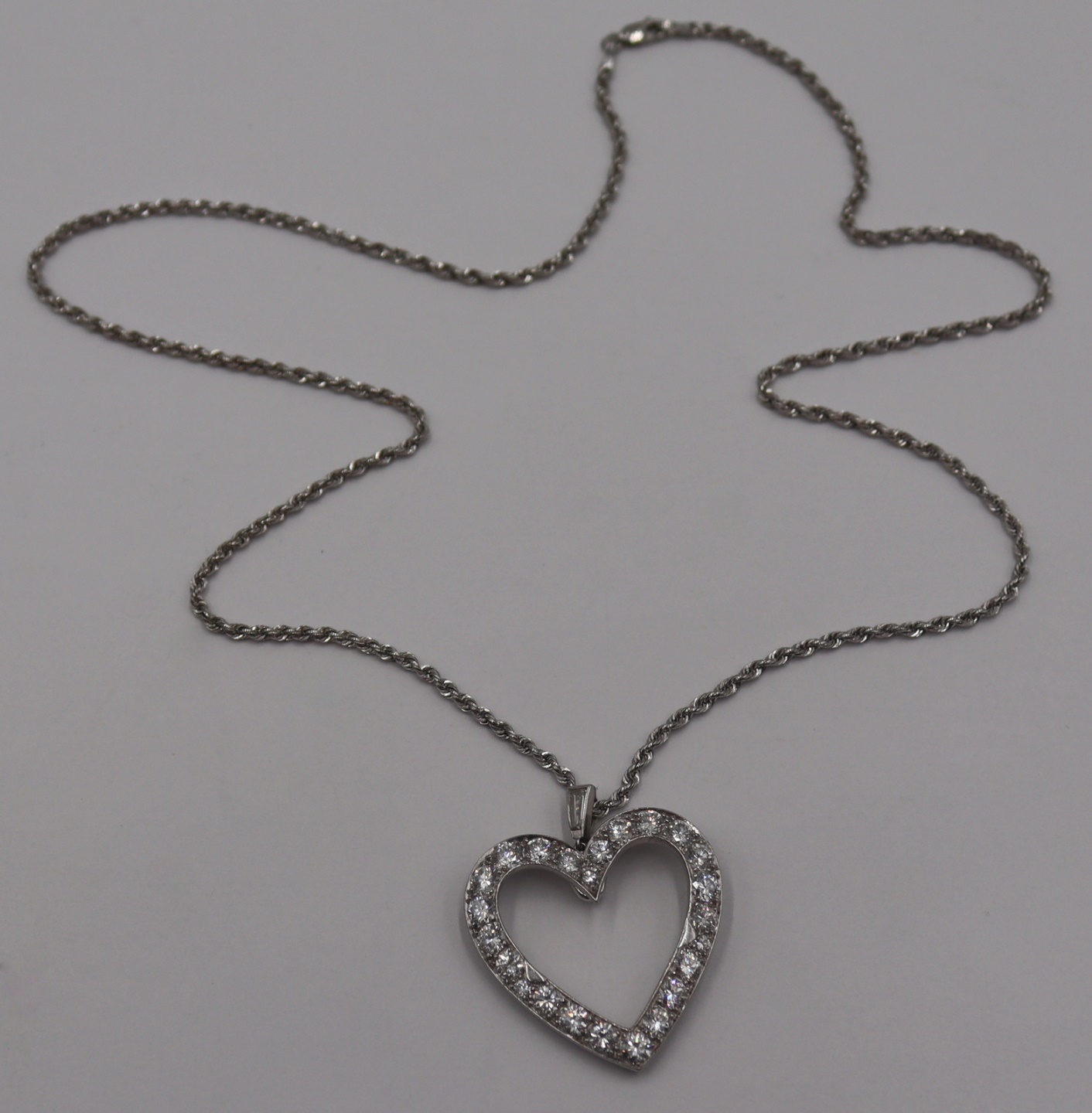 JEWELRY. PLATINUM AND DIAMOND HEART