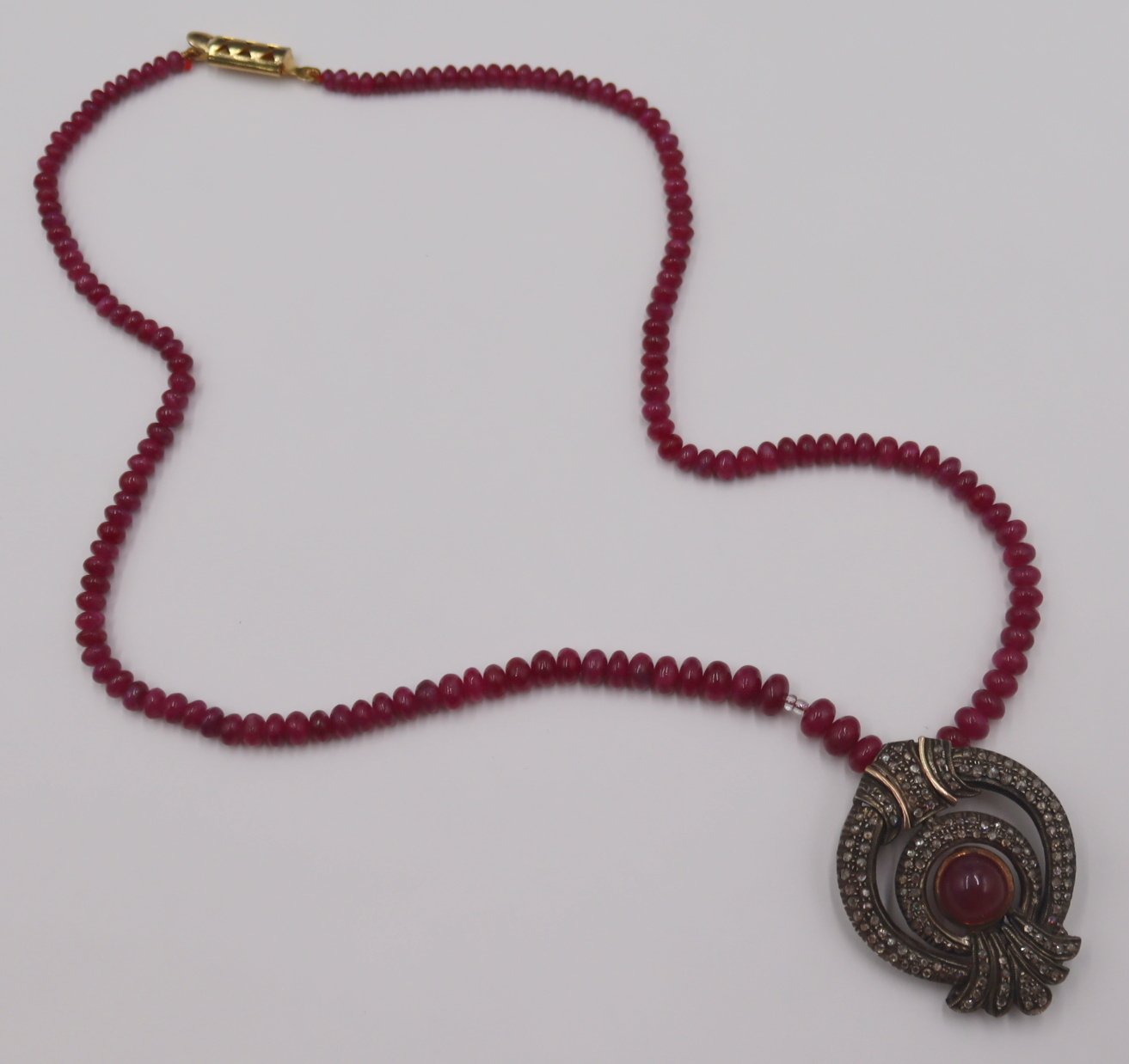 JEWELRY. POLISHED RUBY AND ROSE CUT
