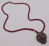 JEWELRY. POLISHED RUBY AND ROS