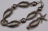 JEWELRY. SILVER FISH AND SHELL