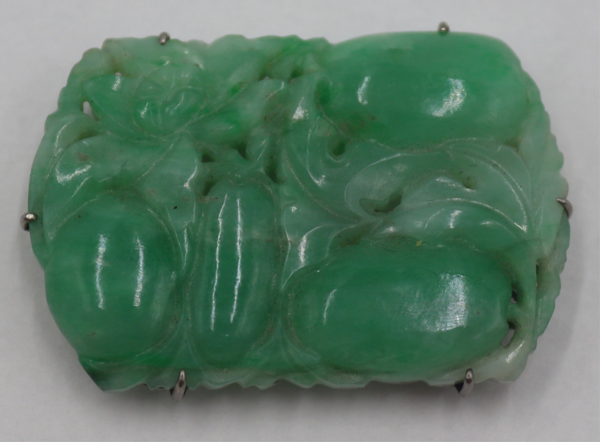 JEWELRY. SILVER MOUNTED CARVED JADE