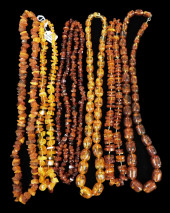 JEWELRY: SIX AMBER OR AMBER TY