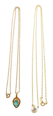JEWELRY: TWO GOLD PENDANTS WIT