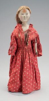 Jointed wooden doll, yellow pi