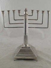 Judaica; a silver chanukia lig