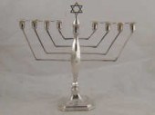 Judaica; a silver chanukia lig