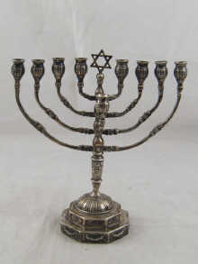 Judaica; a silver menorah with