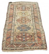 KAZAK RUG A column of five oct