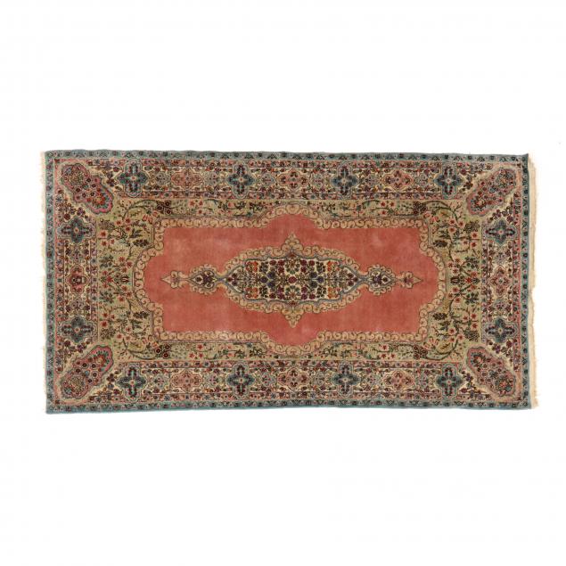 KERMAN AREA RUG The floral-filled