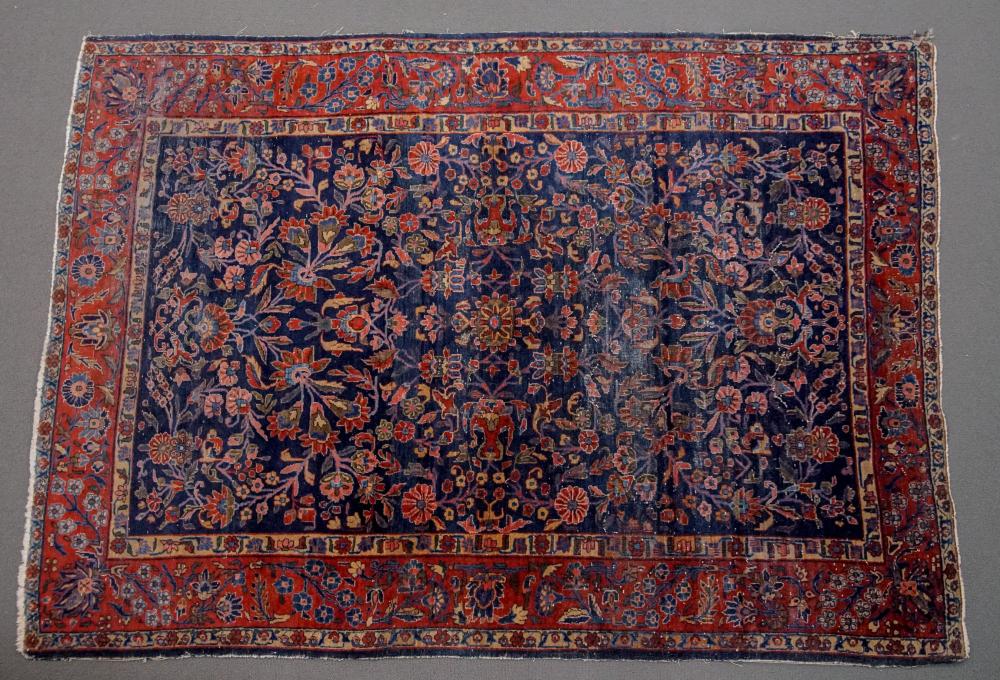 KESHAN RUG AND A KAZAK RUG, FIRST