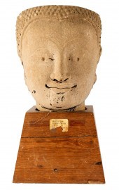 KHMER CARVED STONE HEADon wood