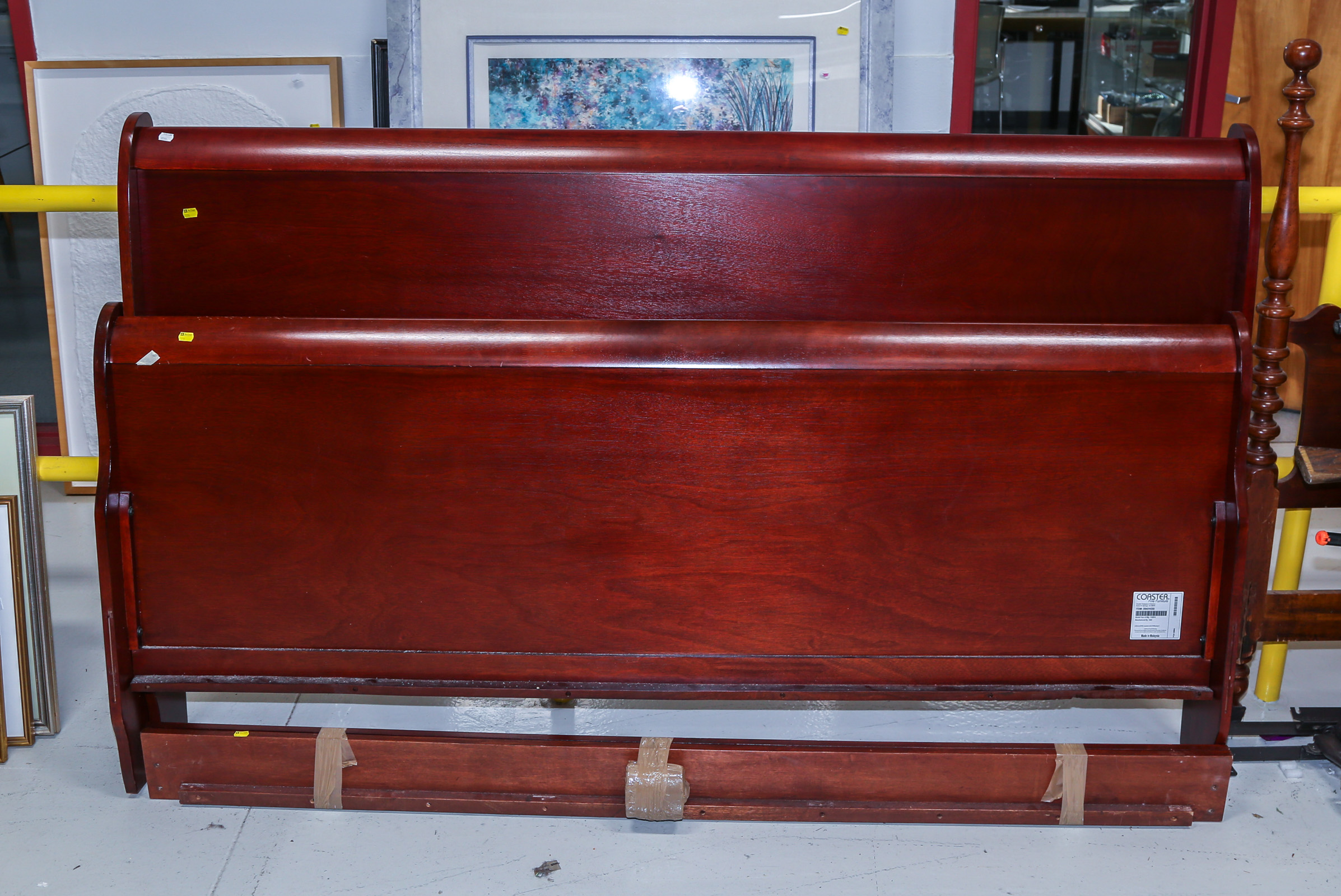 KING SIZED MAHOGANY BEDSTEAD .