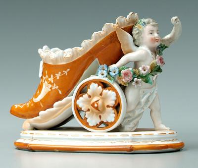 KPM figural shoe, cupid pulling a