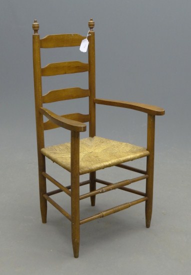Ladderback rushseat armchair.