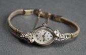LADIES' BULOVA 14-KARAT WHITE-