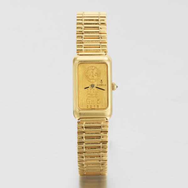 LADIES' CORUM 18K GOLD DRESS