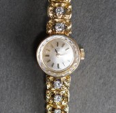 LADIES' OMEGA 14-KARAT YELLOW-