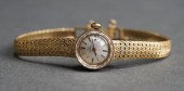 LADIES' OMEGA 14-KARAT YELLOW-