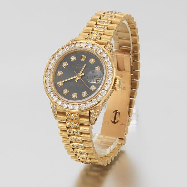 LADIES' ROLEX 18K GOLD AND