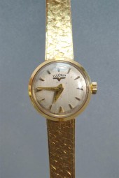 LADIES' VULCAN 18-KARAT YELLOW