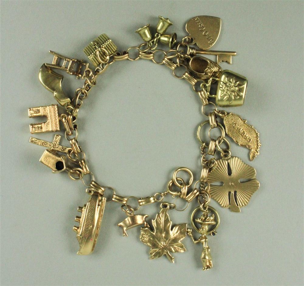 LADY'S 14K CHARM BRACELET hung with