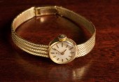 LADY'S EIGHTEEN KARAT GOLD WRI