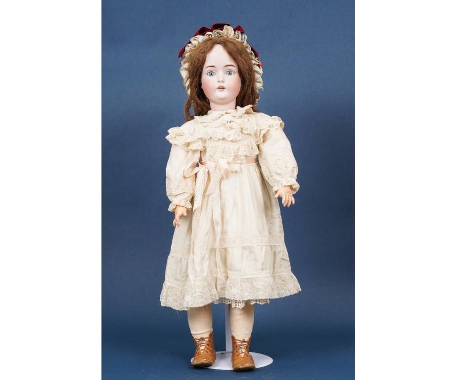 Large bisque head doll marked
