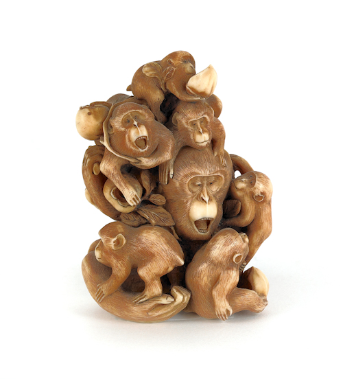 Large carved ivory monkey form