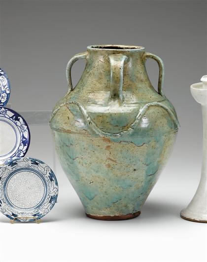 Large glazed four-handled redware