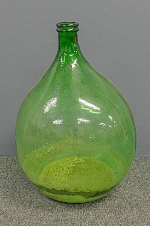 Large green blown glass demijohn