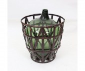 Large green glass demijohn in