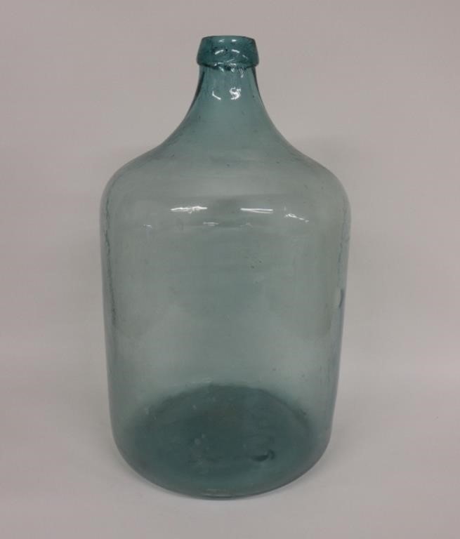 Large green glass water bottle,