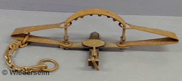 Large iron bear trap marked
