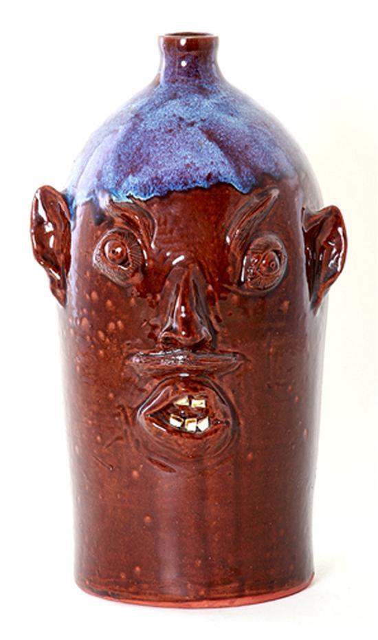 Large Louis D. Brown stoneware face