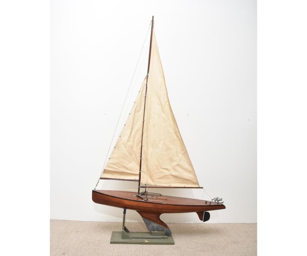Large mahogany racing boat pond