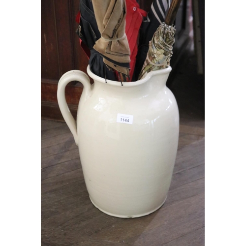 Large pottery glazed jug, applied