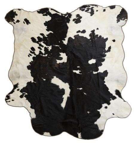 LARGE TANNED BROWN & WHITE COW