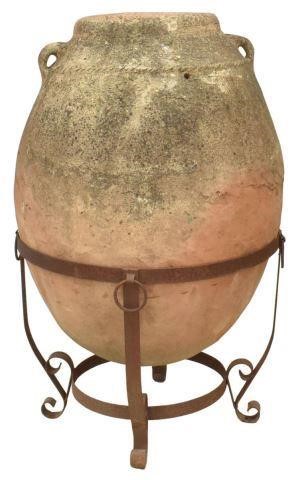 LARGE TERRACOTTA JAR ON WROUGHT