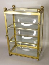 LATE BALL FOOTED BRASS CURIO D