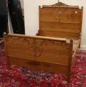 LATE VICTORIAN CARVED OAK BED