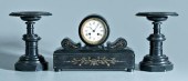 Late Victorian clock and garni