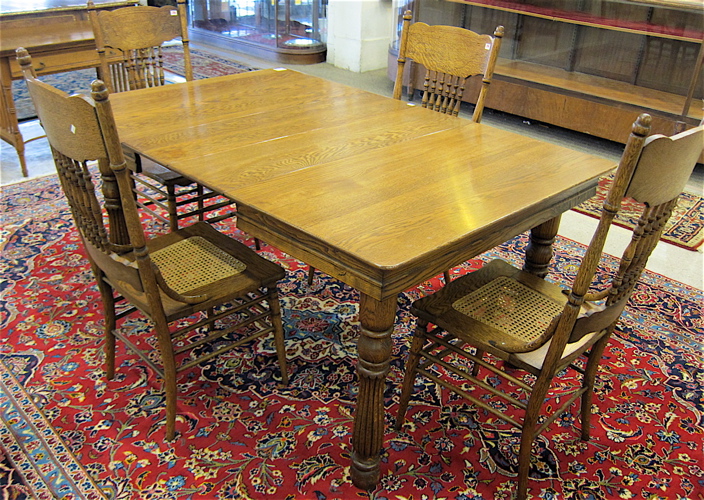 LATE VICTORIAN OAK DINING TABLE AND