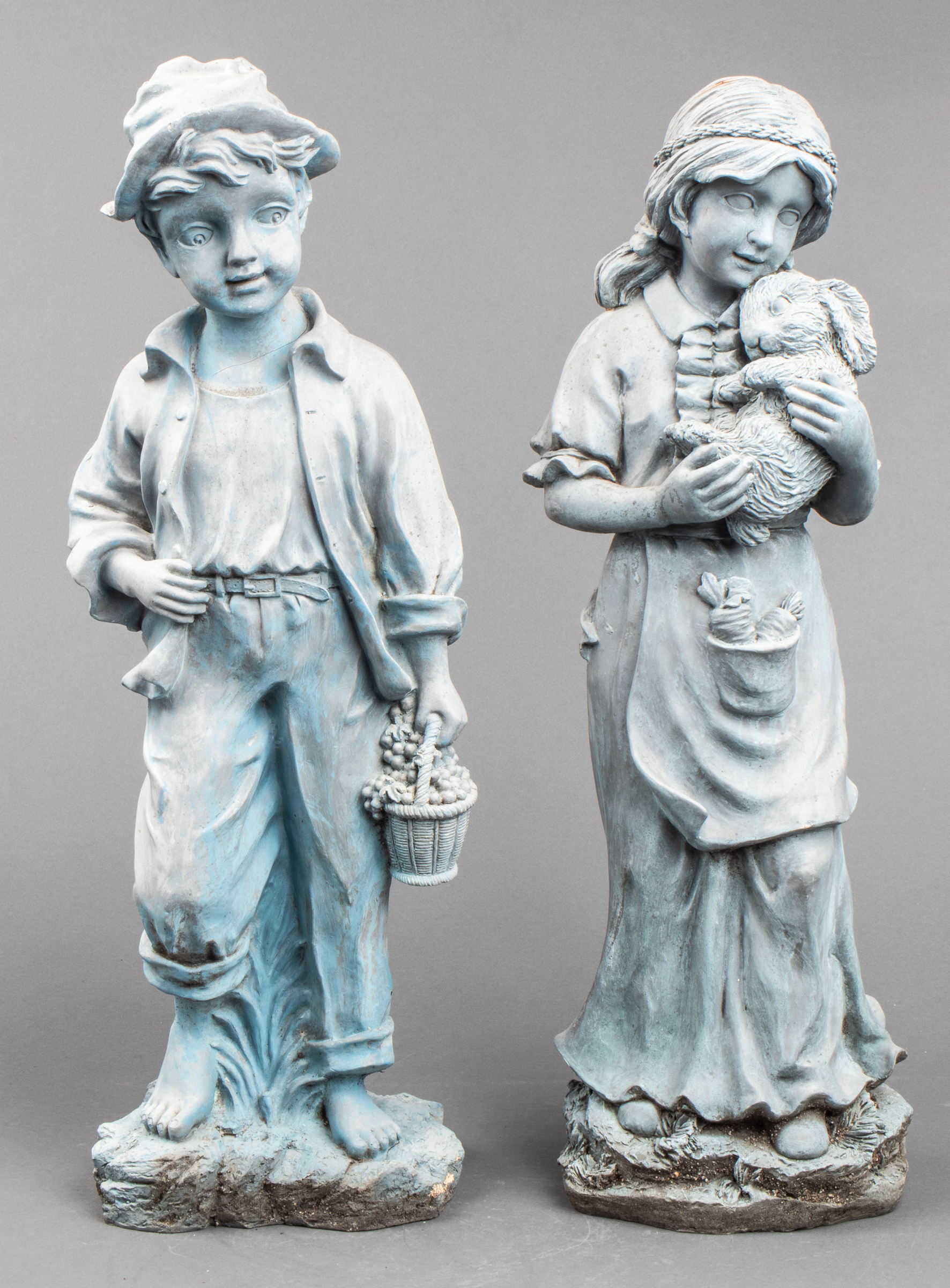 LAWN SCULPTURES OF BOY AND GIRL,