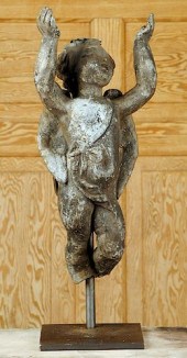 LEAD PUTTO SCULPTURE ON MUSEUM