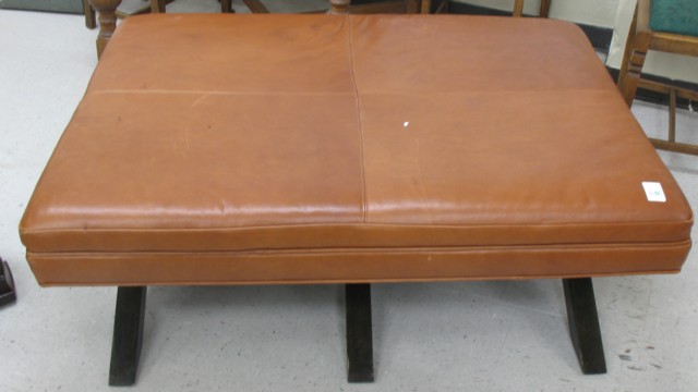 LEATHER COFFEE TABLE OTTOMAN having