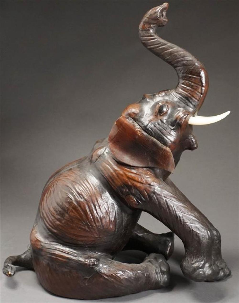 LEATHER MOUNTED SEATED ELEPHANT,