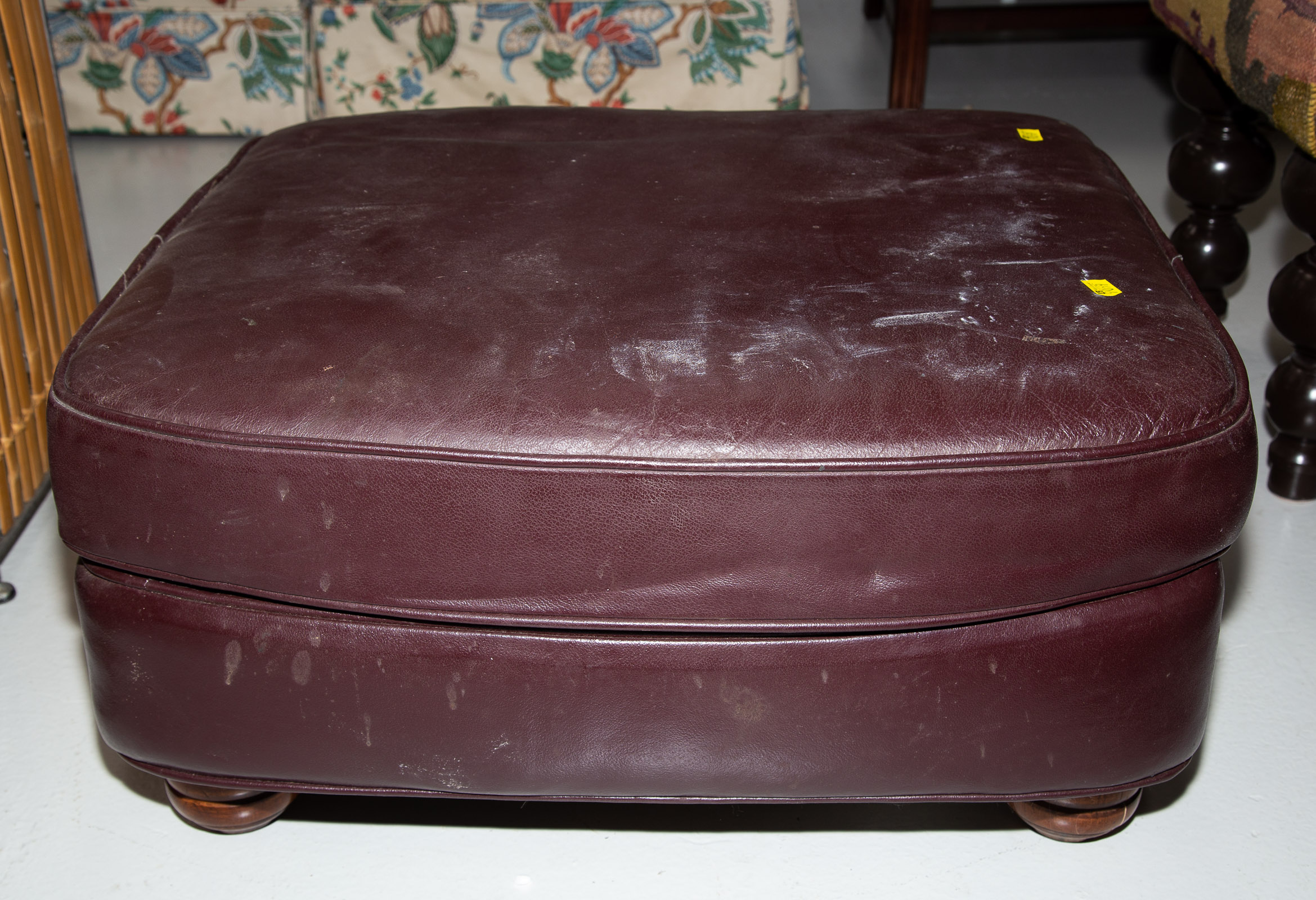 LEATHER OTTOMAN .