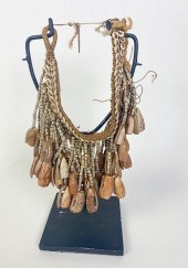 LEG ORNAMENT, WITH WOVEN FIBER