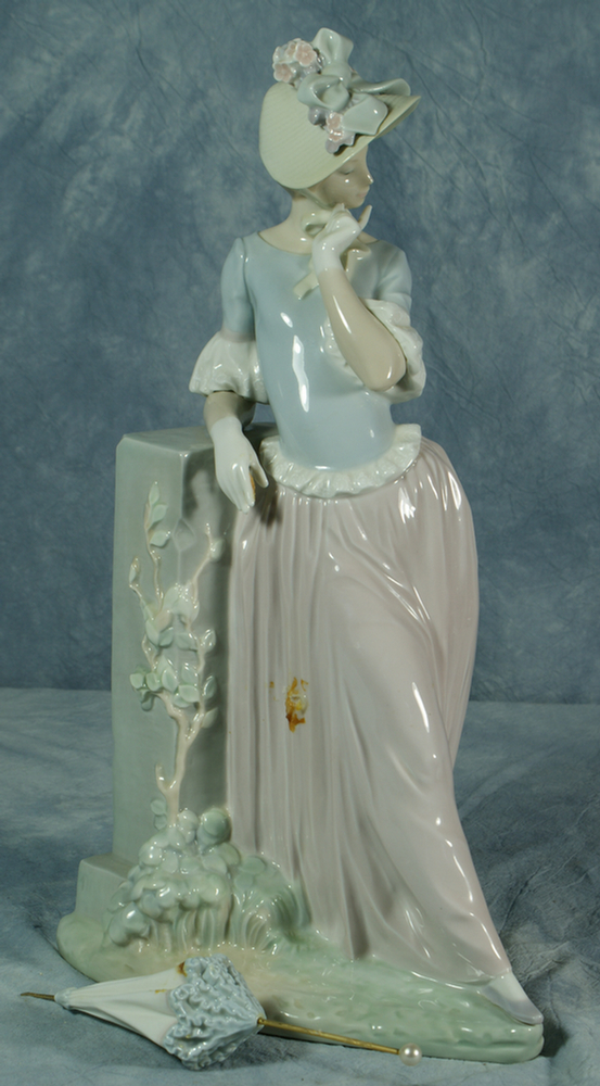 Lladro figurine, woman holding an